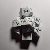 Seven dice under normal white light.